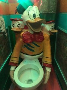 Donald Duck and his nephews fused into a toilet