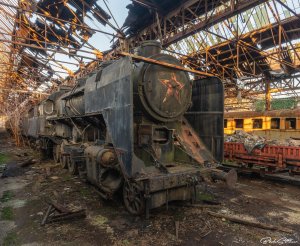 An abandoned train with a red star of the Soviet Union.