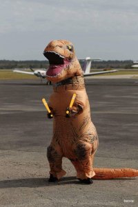 When a small airport FBO gets access to an inflatable T-Rex outfit, silliness occurs.