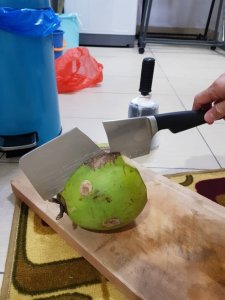 WCGW chopping a coconut
