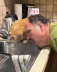 My brother-in-law helping his buddy Dobby look for the brain cell.